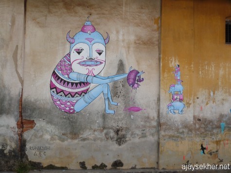 A mural on an abandoned godown wall by artists from Europe