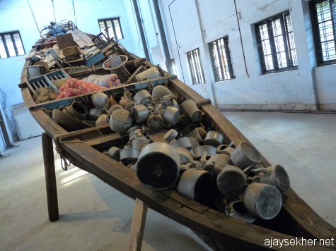 Phenomenal and awesome: Subodh Gupta's big installation using an old country boat of Kochi at Aspinwall.