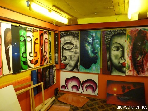 Colours of enlightenment:  Various facets of the buddha and his symbol the elephant painted by a north Indian artist in his studio gallery on the cliff at Varkala Papanasam.