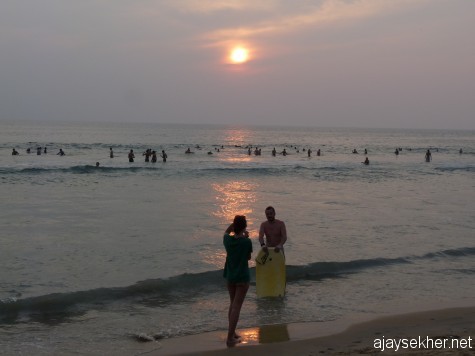 A couple from alien shores: Sunset at Papanasam beach, Varkala. 2012 Christmas comes to an end...
