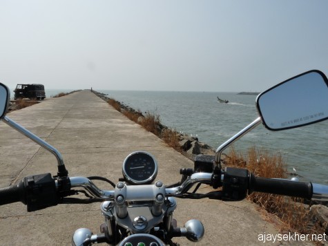 Riding into the sea.  Wave breaker or Pulimuttu at the mouth of Chaliyar that allows the Bepur port and fishing docks in Chaliyar estuary.