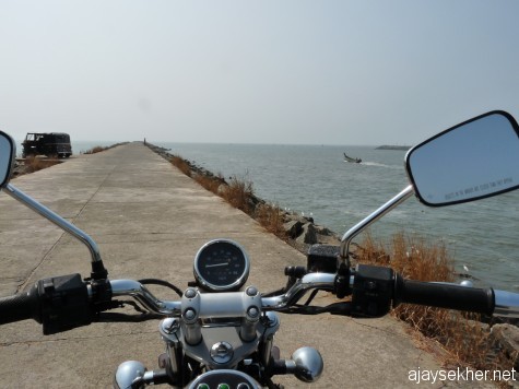 Riding into the sea. Wave breaker or Pulimuttu at the mouth of Chaliyar that allows the Bepur port and fishing docks in Chaliyar estuary.