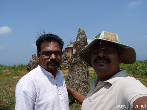 Beore the big menhir at Panjalimed with Anirudh.  A left hand self click in good morning light.