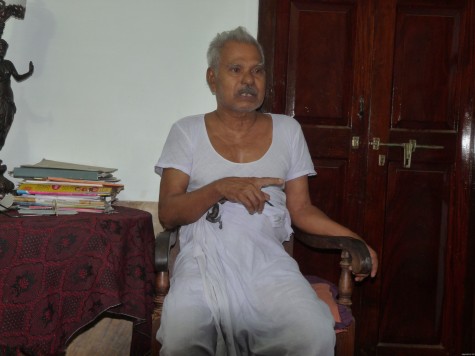 Aandi Kutty Master narrating the early 20th century saga of Pariyapuram and the Buddhist cave at his home in Pariyapuram.  Early Apl 2013.  Thanks to his family for good coffee and jack chips.
