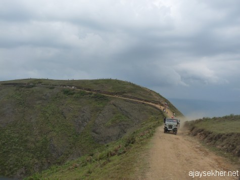 Jeeps plying from Kumaly to Mangaladevi shrine through mountain roads over the grasslands on the Kerala-Tamil border.